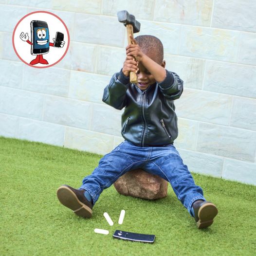Kid Breaking Phone Device with Hammer