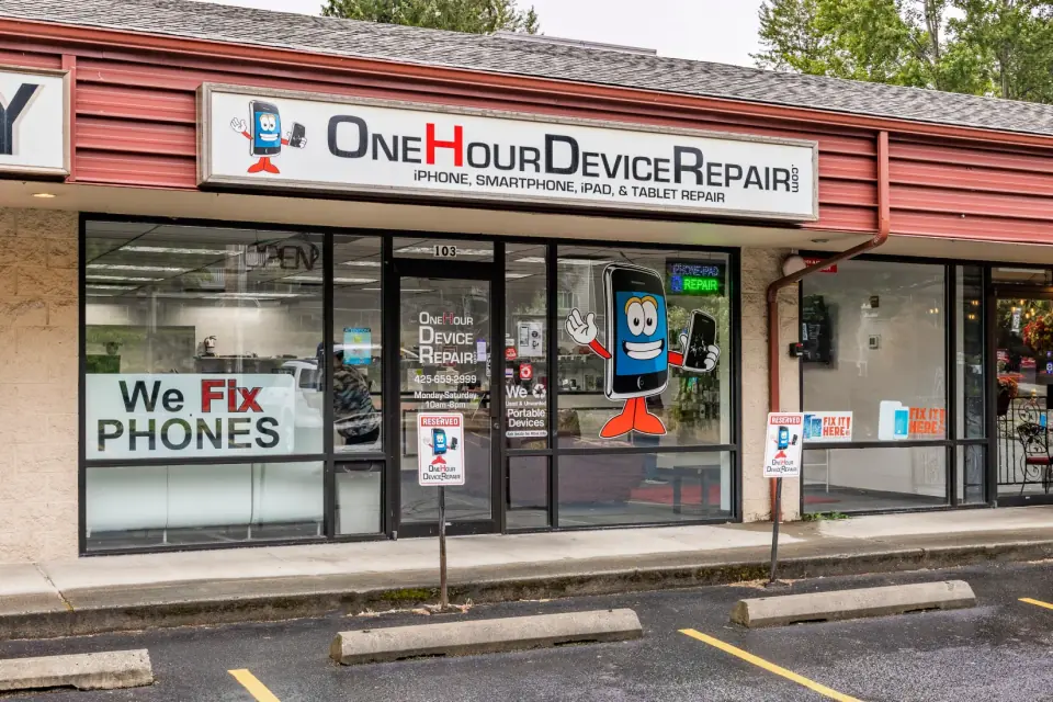 The One Hour Device Repair storefront in Bothell, with the mascot in the window