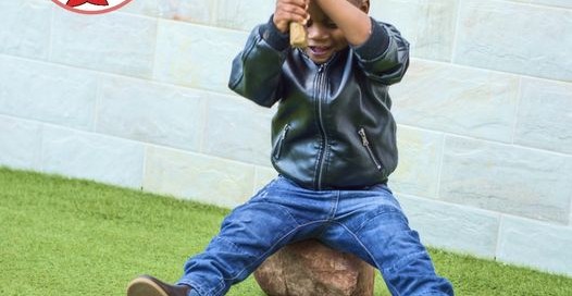 Kid Breaking Phone Device with Hammer